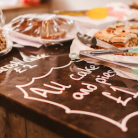 A close-up angle of a cake sale from a fundraising event