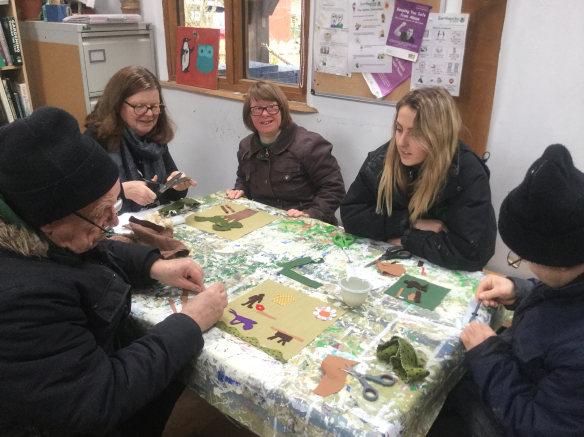 A group of three Earthworkers, one Volunteer, one staff member, creating textile art