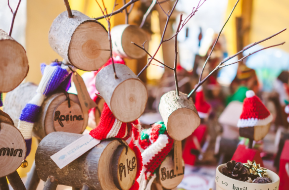 Crafted wooden reindeers with scarves on